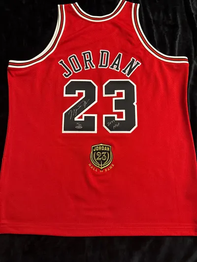 Michael Jordan signed with inscription “HOF” and patch jersey