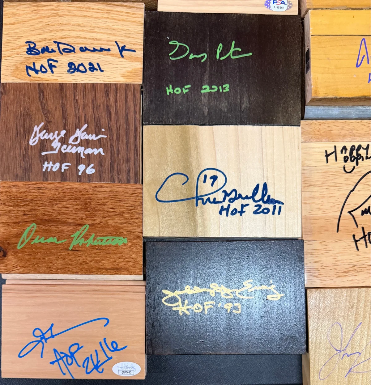 Game Used Floor and Wood Pieces Signed by NBA Hall of Famers - Collection Lot